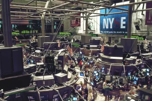 Traders and financial data screens in a busy stock market setting