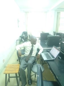 professionals working with AI tools on laptops in office
