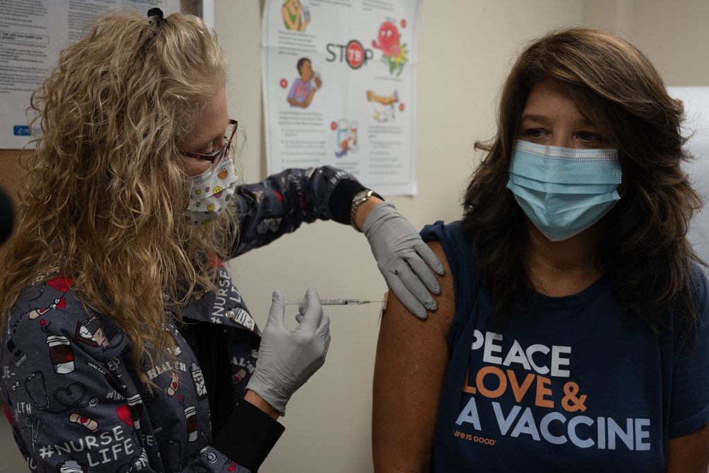 Healthcare worker preparing a measles MMR vaccination dose